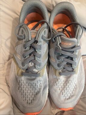 New Balance women’s light Gray and Orange Athletic Sneakers